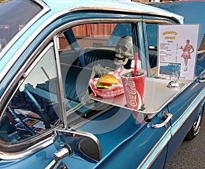 Human Skeleton in a Vintage Car at a Drive-In Diner